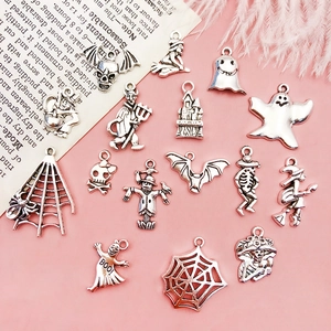 Detail of Halloween DIY pendants including skull and bat in antique silver finish