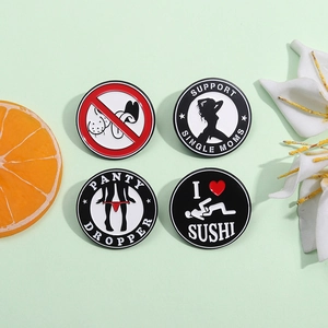 Funny round enamel metal badges in black and red with geometric satirical patterns