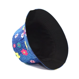 Detail of blue denim bucket hat with colorful daisy print and black inner lining
