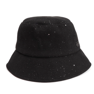 Detailed close-up of a black wool bucket hat featuring shimmering glitter and metal logo tag
