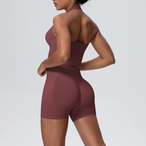 Detail of high-stretch seamless yoga set with halter back bra and lifting gym shorts