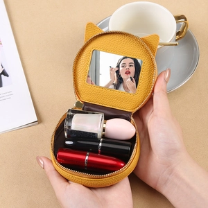 Mini cat ear makeup bag in yellow leather with mirror and zipper for cosmetic storage