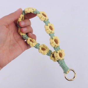 Handmade crochet sunflower wrist lanyard with green woven rope and gold spring ring