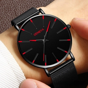 Close-up of Geneva men's slim watch with black mesh strap and red markers on wrist