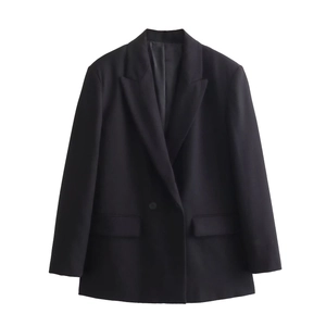 Detailed view of the classic black blazer featuring a notched lapel and sleek side pockets