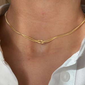 Minimalist gold double strand stainless steel snake chain necklace with a center knot