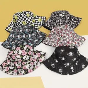 Double-sided bucket hats featuring skull and rose prints for outdoor sun protection
