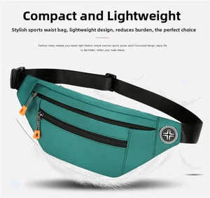 Detail view of lightweight turquoise oxford fanny pack with black zippers and orange pulls