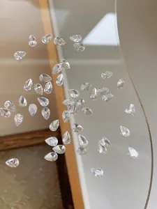 Macro shot of faceted teardrop-shaped transparent rhinestones for nail art designs