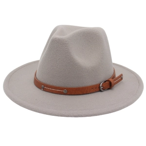 Detailed close-up of light gray wool fedora hat with faux leather belt and metal rivets
