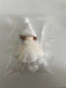 Detailed view of white plush Christmas angel hanging ornament with silver sequin wings