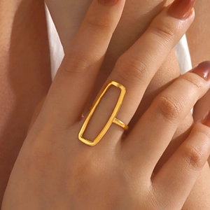 Polished 18K gold plated stainless steel rectangular open ring on model finger