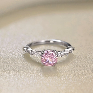 Macro shot of 925 silver ring featuring a large pink stone and marquise accents
