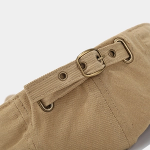 Detail of khaki twill canvas hat featuring a vintage bronze metal adjustable buckle