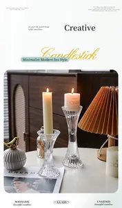 Detailed close-up of ribbed texture on vintage clear glass hourglass candlesticks