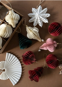 Christmas paper honeycomb ornaments set with snowflake and tree shapes in festive colors