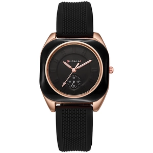 Detail showing the black silicone textured strap and rose gold square case of the quartz watch