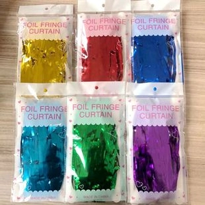 Multipack of laser foil fringe curtains in various vibrant colors for party decorations