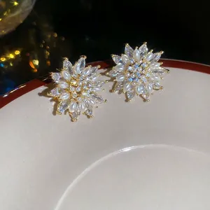 Elegant 18k gold plated flower stud earrings with shimmering pearls and zircon crystals