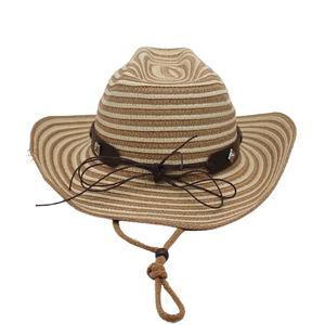 Detail of striped straw cowboy hat with leather band, silver studs and adjustable chin cord