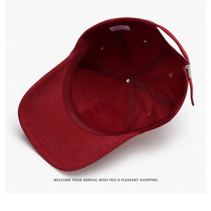 Detail view of cotton baseball cap interior showing sewing seams and wash label