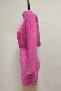 Close-up of rose pink long sleeve dress with silver rhinestones and ruched detailing