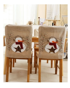 Detail of Christmas chair covers with snowman embroidery and JOY star on burlap fabric
