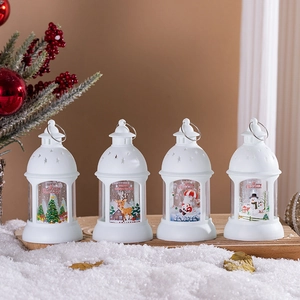 Set of four white Christmas LED lanterns with festive holiday patterns and hanging rings