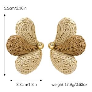 Macro detail of handmade raffia butterfly earrings with size metrics and gold beads