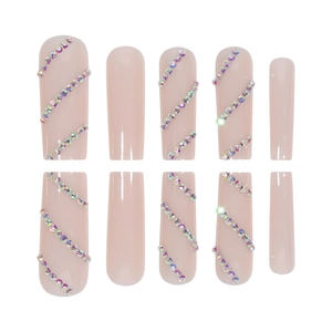 Nude pink coffin false nails with sparkling multi-colored rhinestones on white background