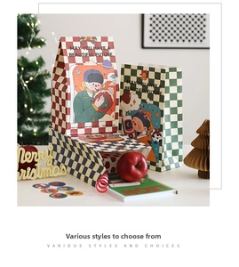 Close-up of premium checkered Christmas gift bags with artistic hand-painted illustrations