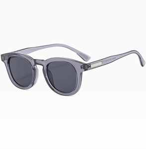 Detailed side view of oval grey sunglasses showing the metal hinge and frame texture