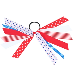 Girl's US flag bow hair scrunchie with stars and stripes patterns on a white background