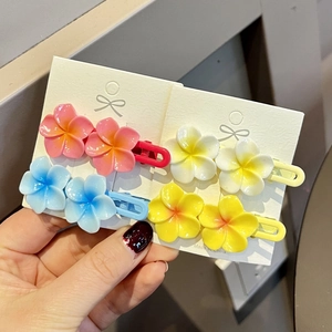 Set of colorful plumeria flower duckbill hair clips in pink blue white and yellow