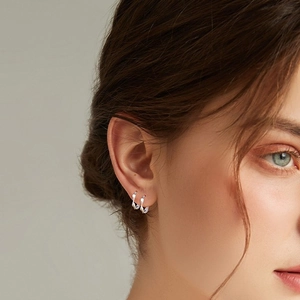 S999 sterling silver Mobius hoop earrings with elegant twisted design for women