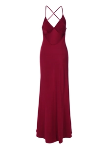 Detail view of burgundy satin dress showing V-neck design and crisscross back straps