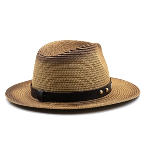 Detail of hand-woven straw fedora with brown leather band and gold metal studs