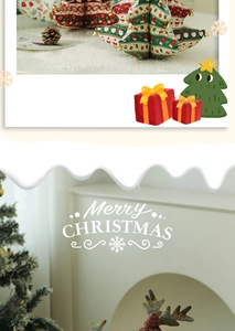 Close-up of fabric Christmas tree and reindeer plush ornaments for festive table decor