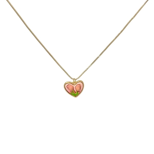 Pink heart tulip pendant necklace with elegant gold chain for women on white background