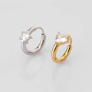 Detail of silver star and gold heart stainless steel hoop earrings with clear zircons