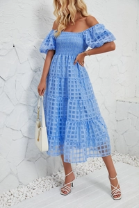 Detail of off-shoulder light blue checkered dress with puff sleeves and layered skirt