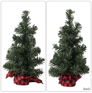 Mini Christmas tree with green needles and red-black checkered burlap base view