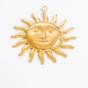 Macro shot of 18k gold plated sun face charm with polished finish and metal loop detail