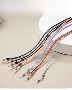 Detail of colorful wax cord eyewear straps with adjustable silicone loops and metal springs