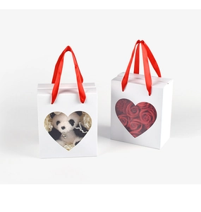 White gift bag with heart window, red soap roses and a cute panda plush keychain accessory