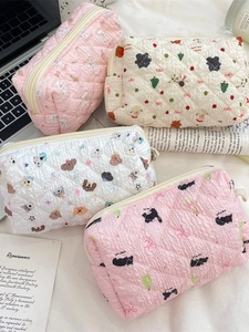 Cute quilted makeup bags with cartoon patterns in pink and white, zipper pouch set