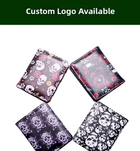 Detail of four folding card holders with skull and floral prints in a high-quality view