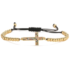 Adjustable gold plated cross bracelet with colorful cubic zirconia and black woven rope
