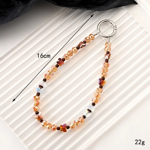 Brown and orange crystal beaded phone strap charm with silver metal clasp, 16cm length