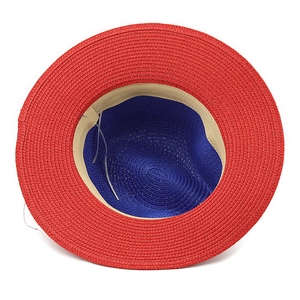 Two-tone Panama straw hat in red and blue featuring a wide brim and classic weave